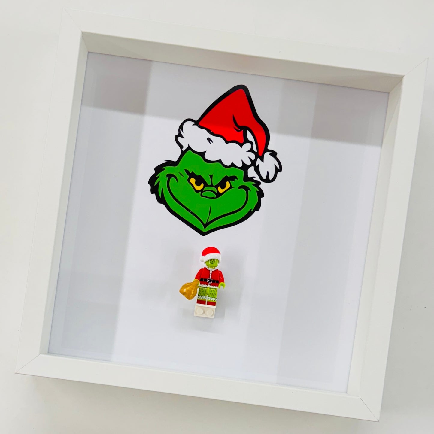 The Grinch figure in a Frame