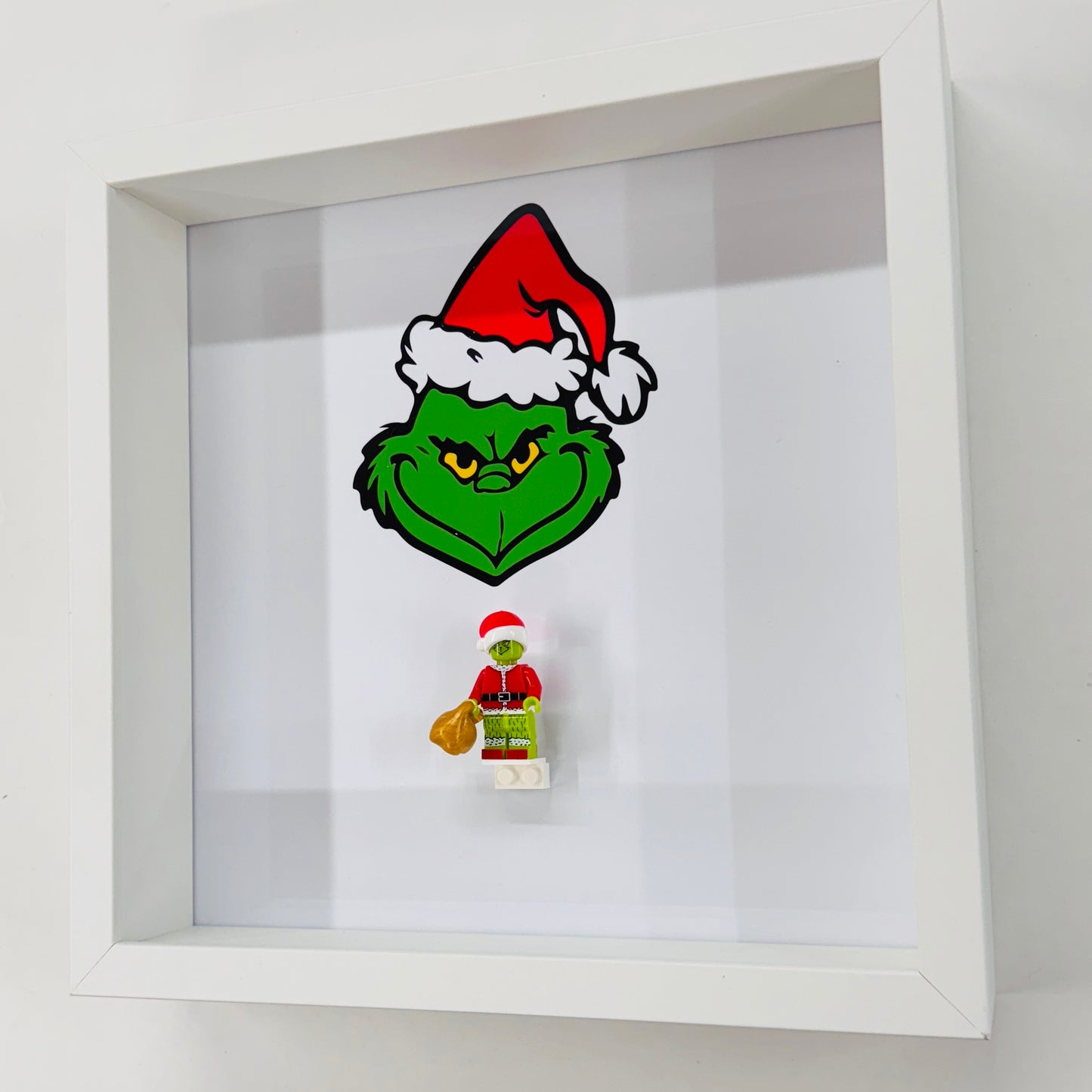 The Grinch figure in a Frame