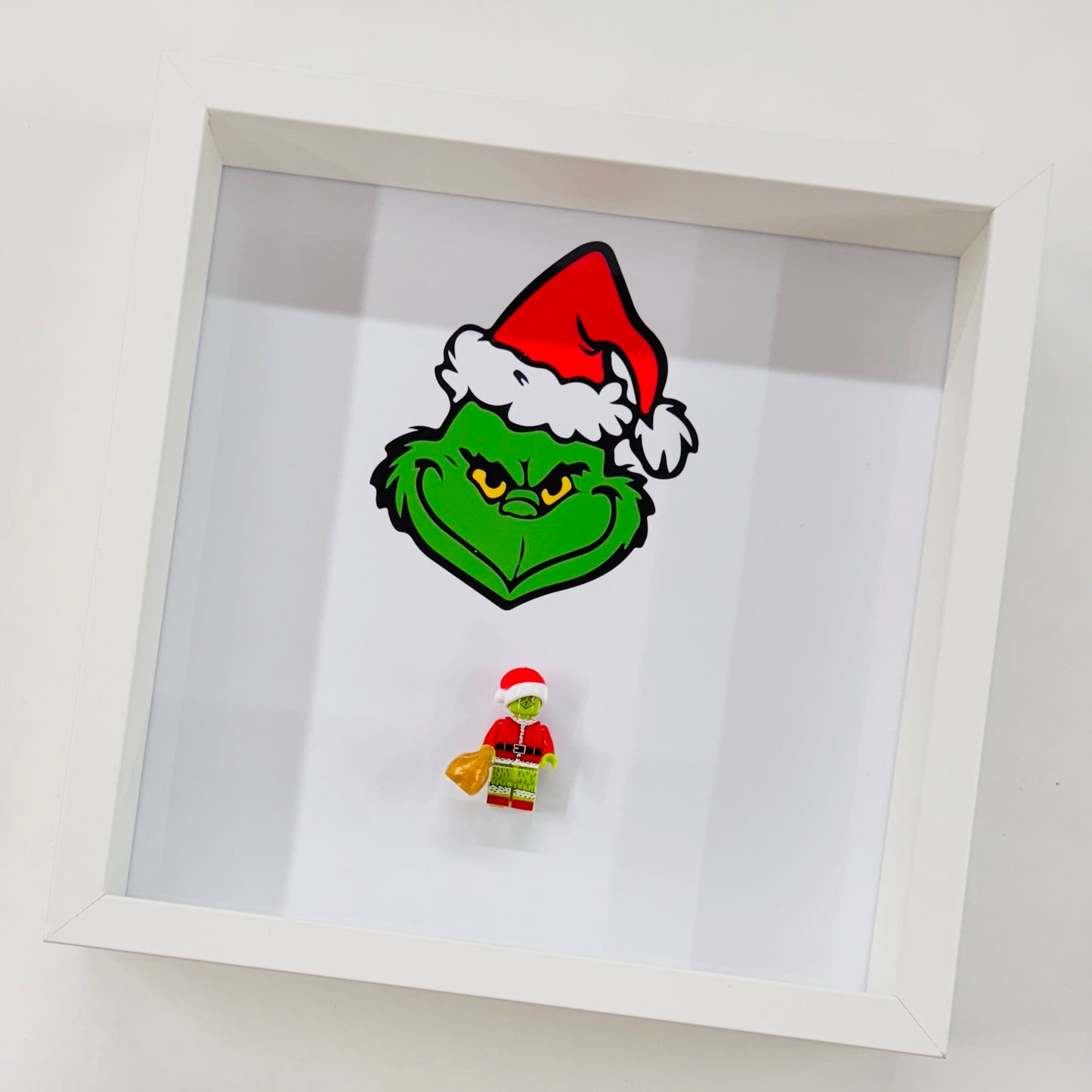 The Grinch figure in a Frame