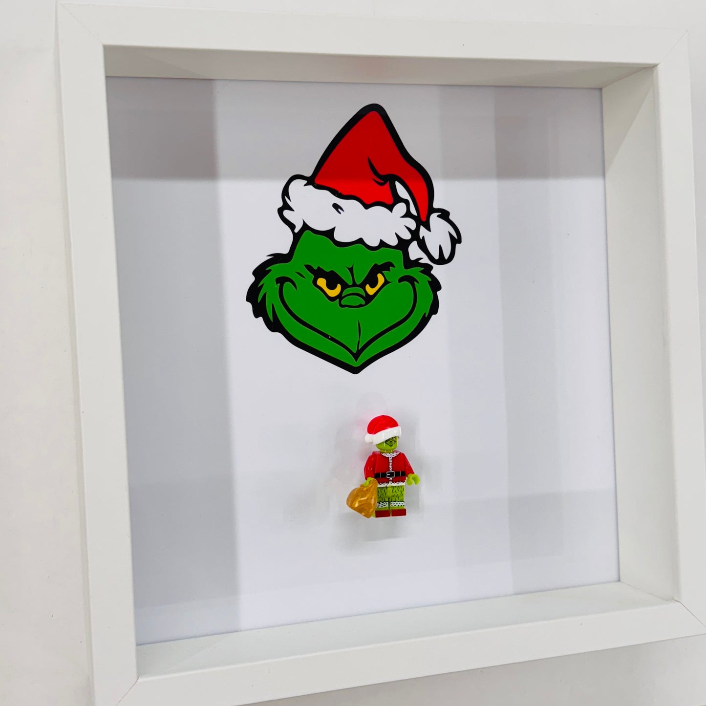 The Grinch figure in a Frame