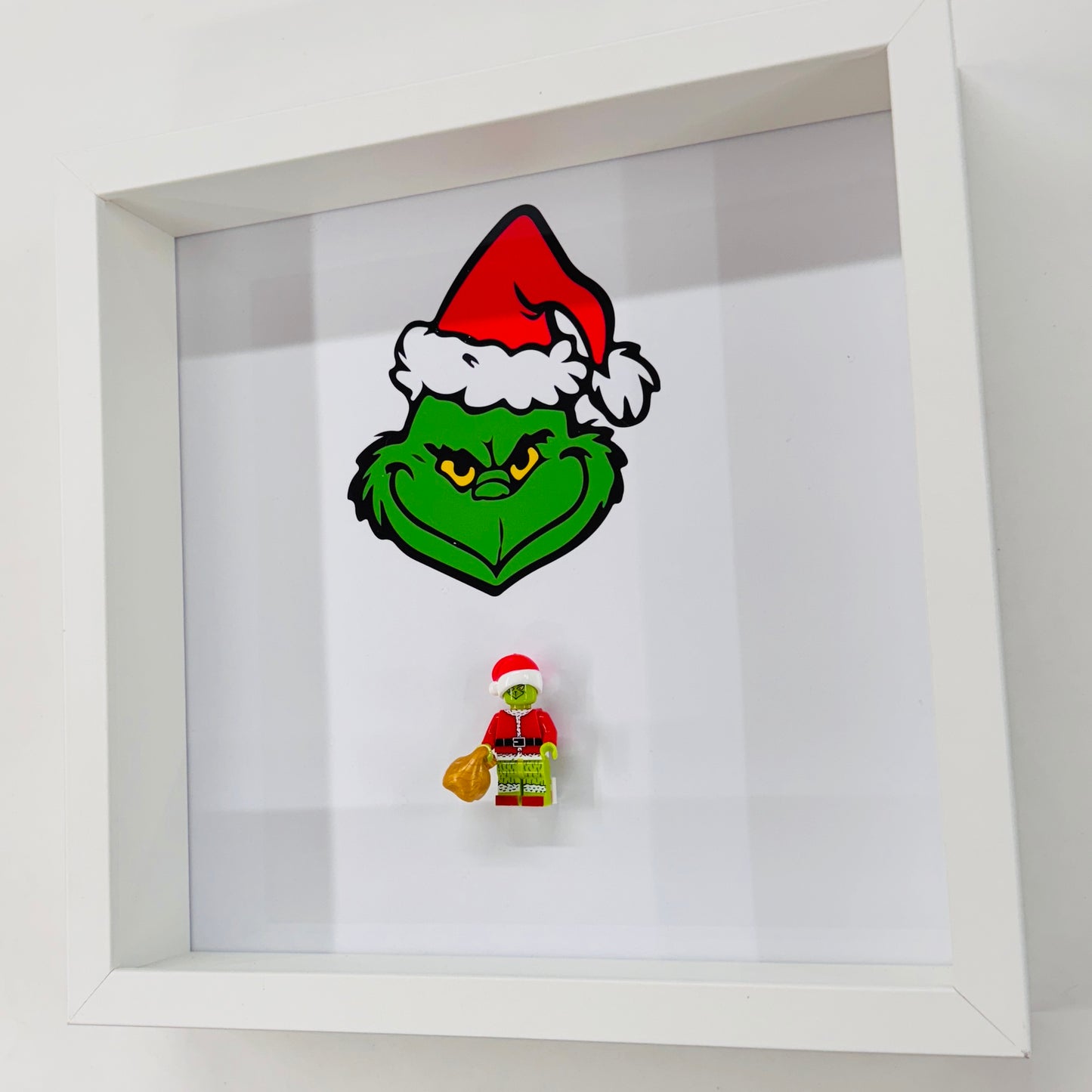 The Grinch figure in a Frame