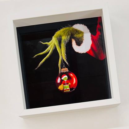 The Grinch figure in a Frame