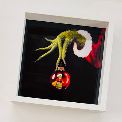 The Grinch figure in a Frame