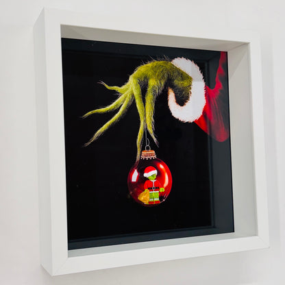 The Grinch figure in a Frame