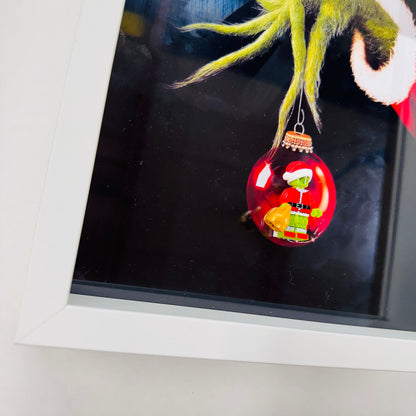 The Grinch figure in a Frame