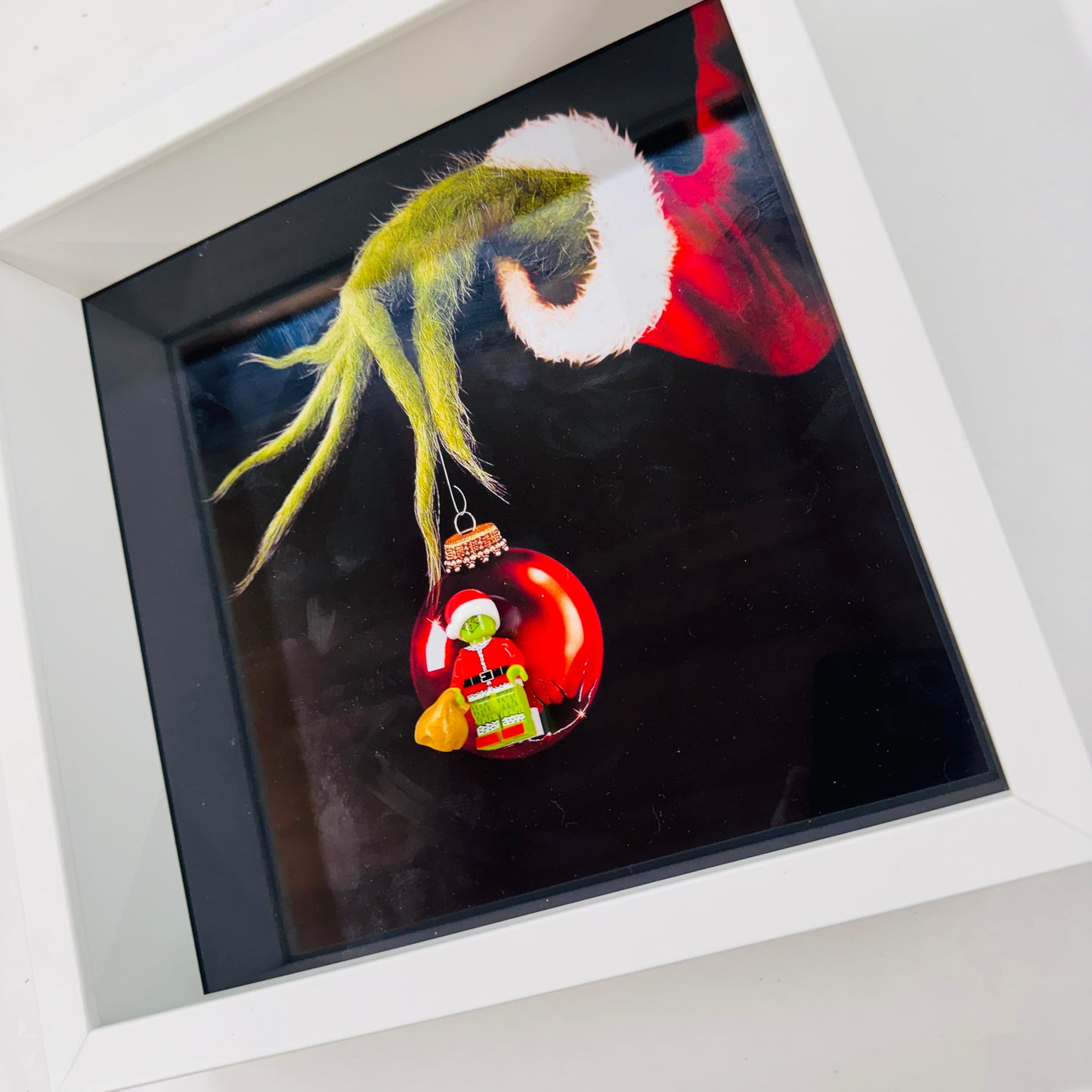 The Grinch figure in a Frame