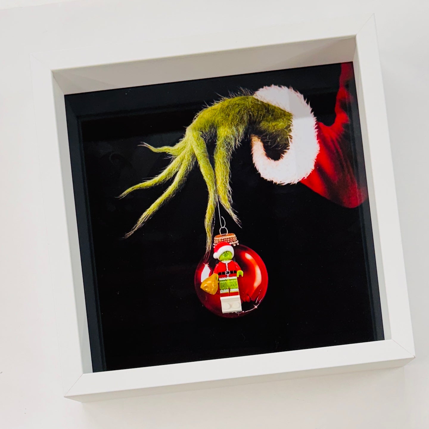 The Grinch figure in a Frame