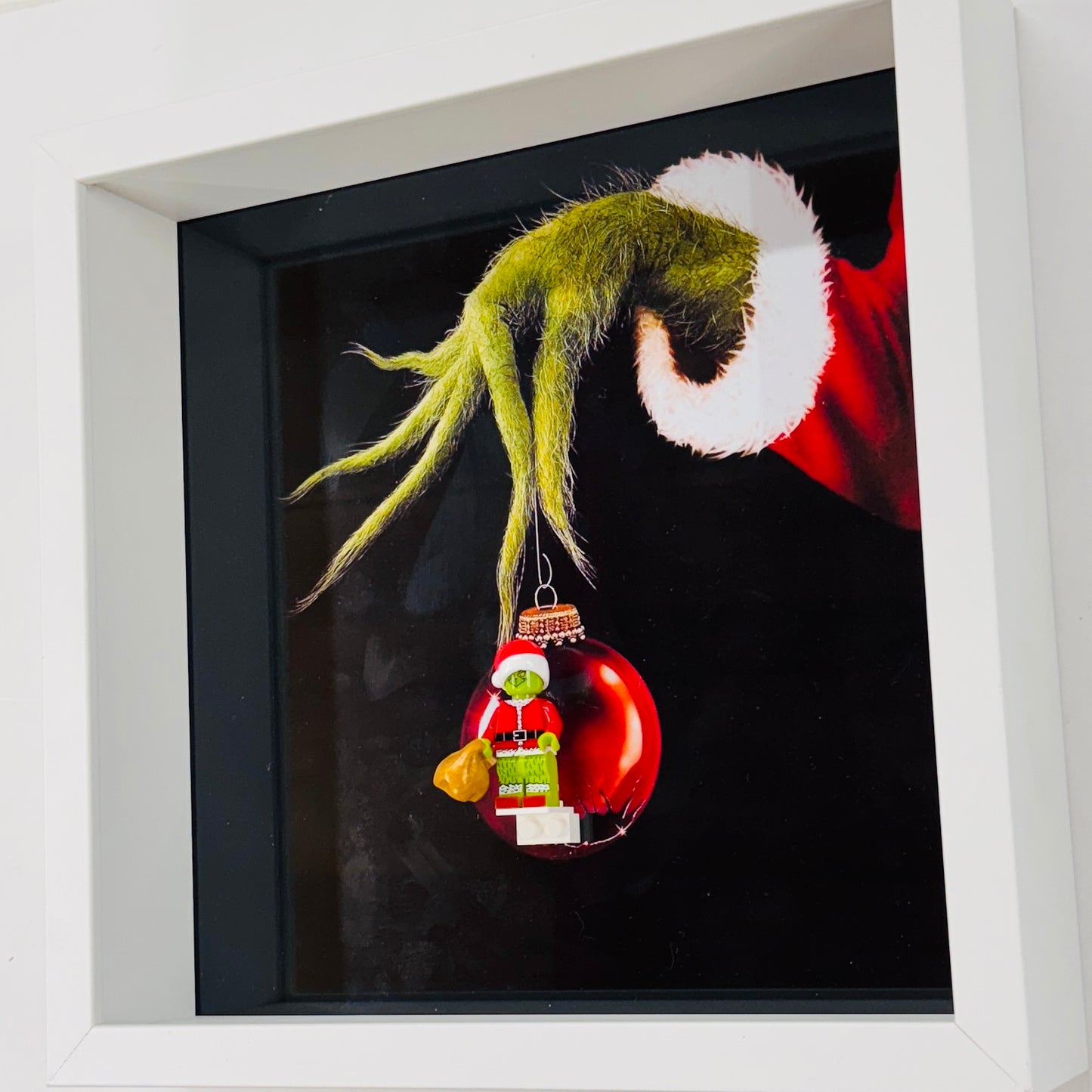 The Grinch figure in a Frame