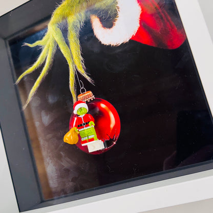 The Grinch figure in a Frame